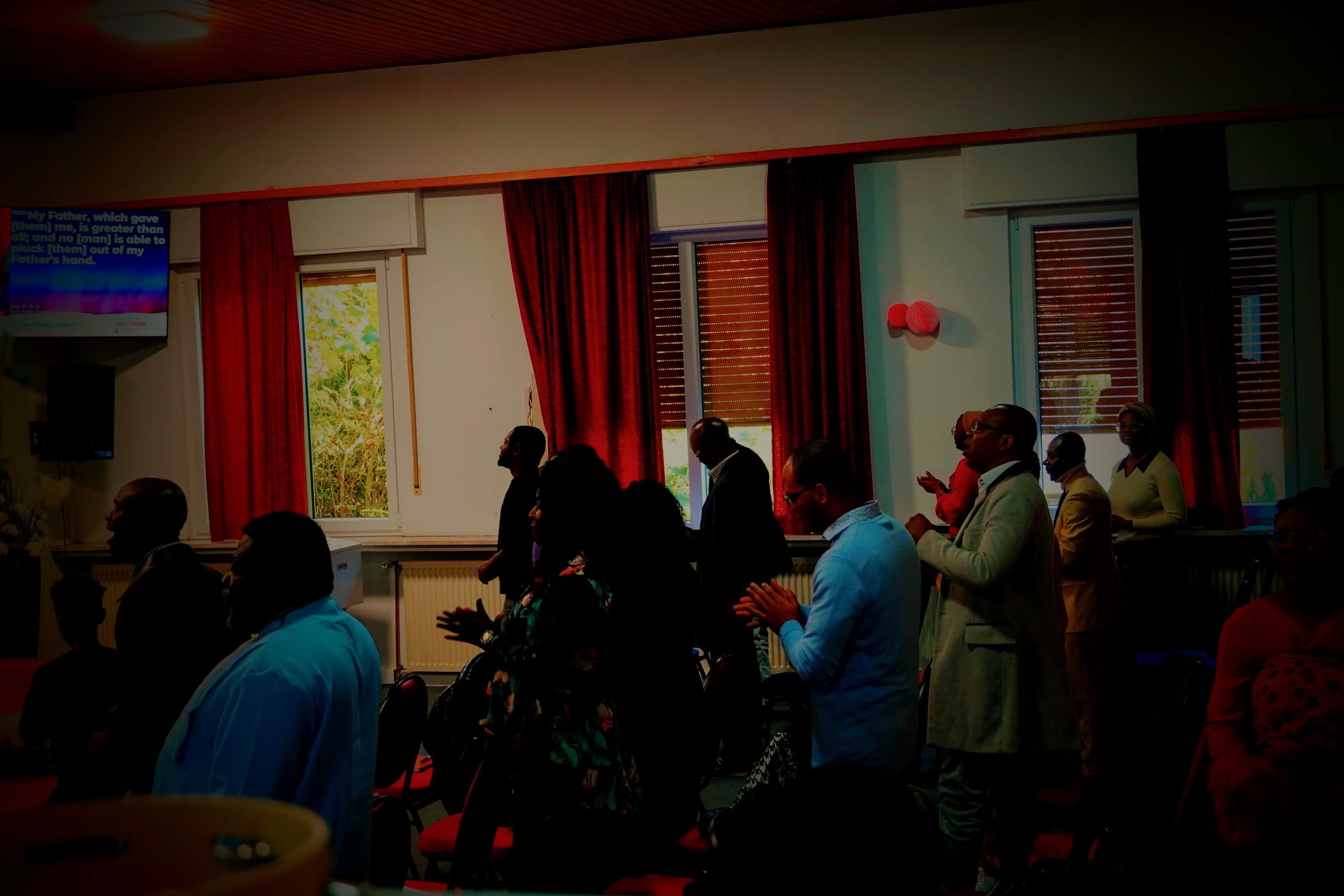 worshipers at watchman church